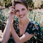 Headshot of Sara in a plant nursery